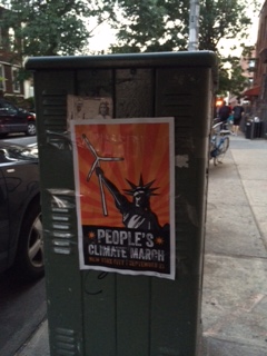 People's Climate March flyer on utility box in Brooklyn